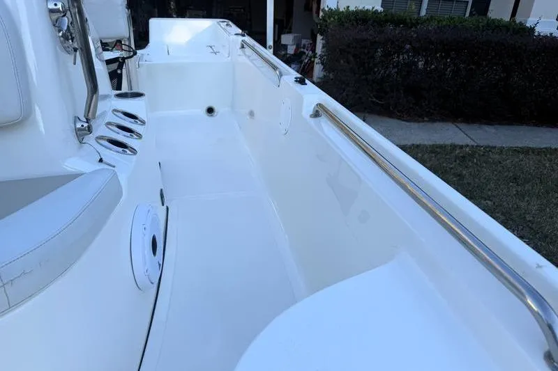 Slide: The Image of 2019 Bulls Bay 2000 boat interior with white seating and stainless steel railings. - 20