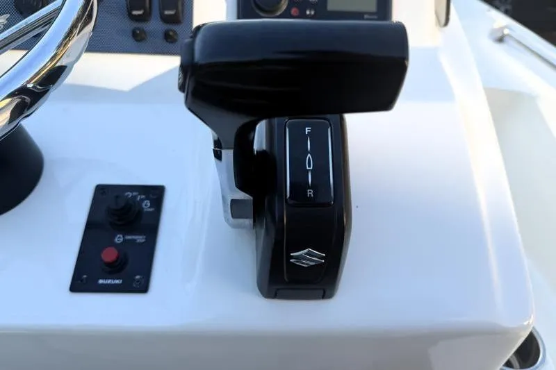Slide: The Image of 2019 Bulls Bay 2000 boat throttle control and steering wheel close-up. - 28