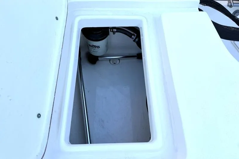 Slide: The Image of Open storage compartment in 2019 Bulls Bay 2000 boat, showing internal components. - 32