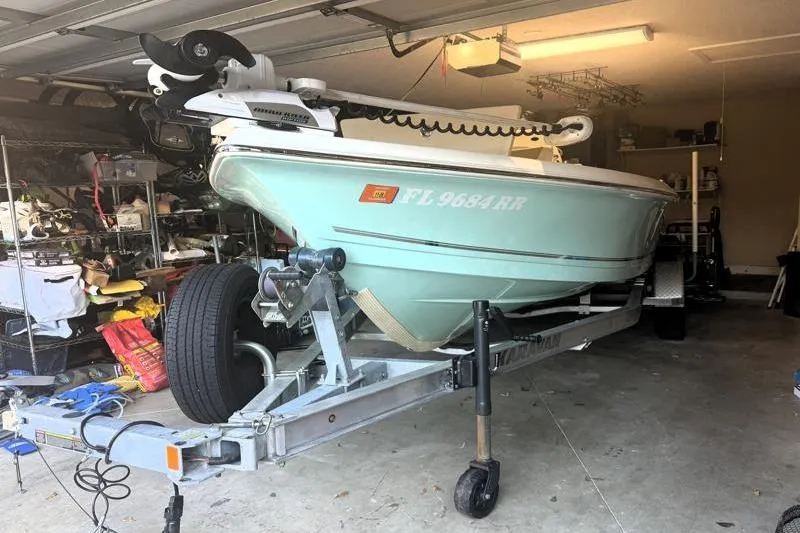 Slide: The Image of 2019 Bulls Bay 2000 boat on trailer in garage setting. - 4