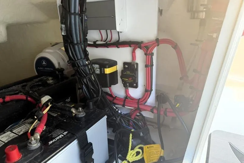 Slide: The Image of Electrical system inside a 2019 Bulls Bay 2000 boat, featuring wiring and battery components. - 40