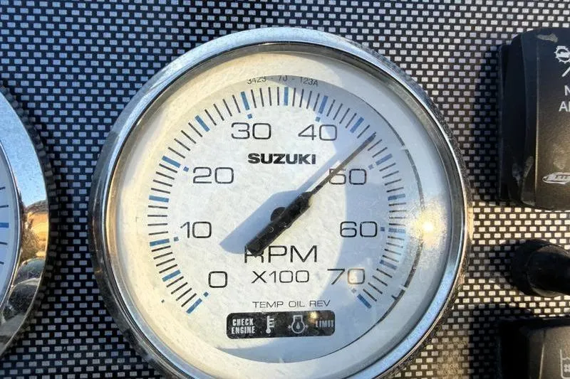 Slide: The Image of Suzuki RPM gauge on Bulls Bay 2000 boat dashboard, 2019 model. - 42