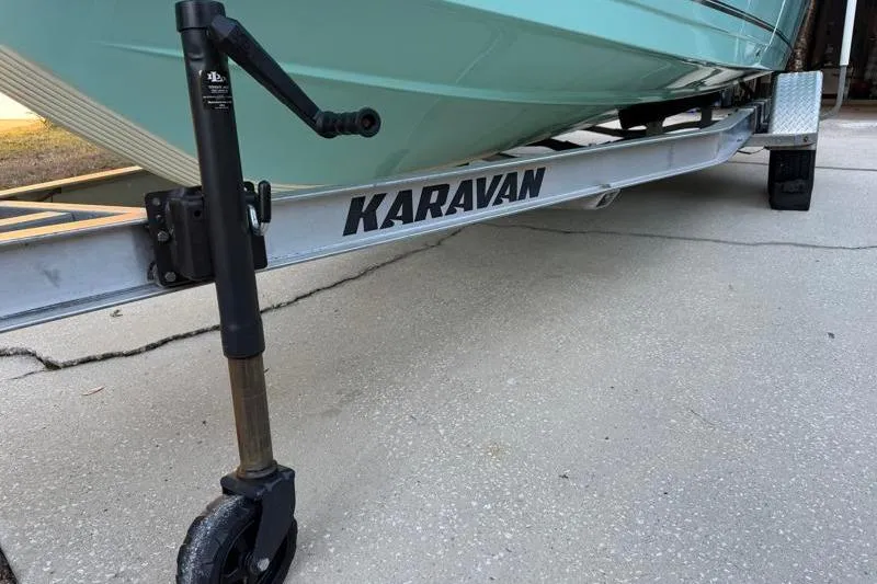 Slide: The Image of 2019 Bulls Bay 2000 boat on Karavan trailer, parked on concrete surface. - 46