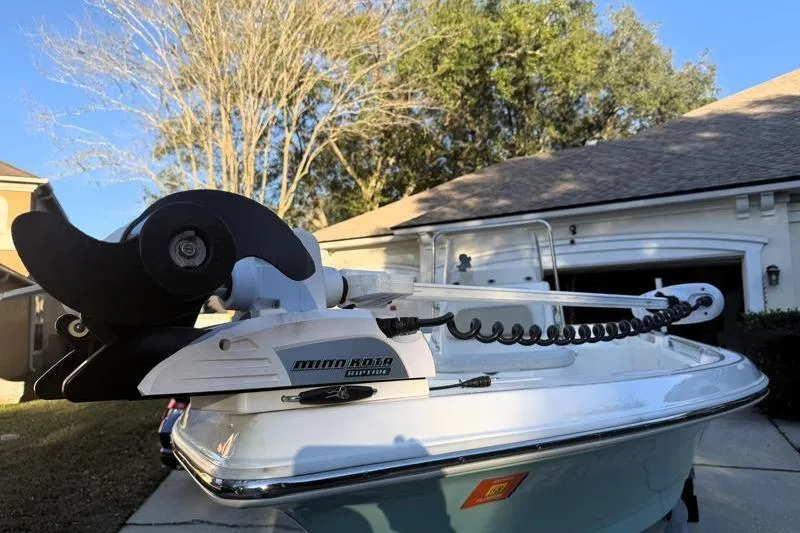 Slide: The Image of 2019 Bulls Bay 2000 boat with Minn Kota trolling motor in residential driveway. - 5