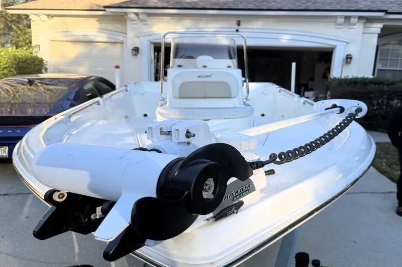 Slide: The Image of 2019 Bulls Bay 2000 boat with Minn Kota trolling motor in driveway. - 8