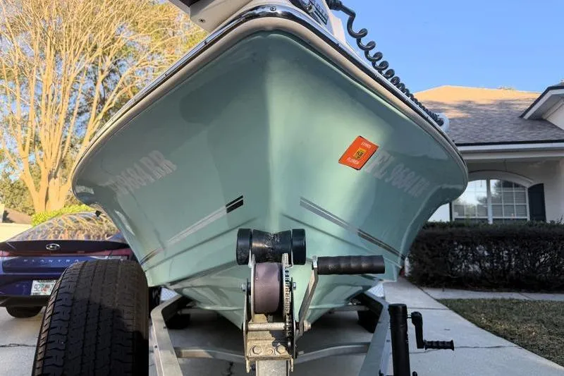 Slide: The Image of 2019 Bulls Bay 2000 boat on trailer, parked in residential driveway. - 9