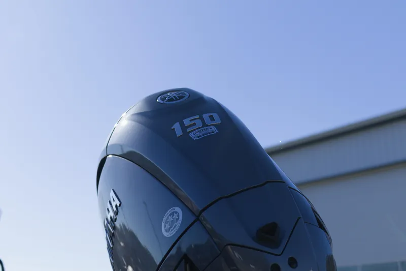 Slide: The Image of Outboard motor on Avid 20 Rogue CC 2026 boat, clear sky background. - 11
