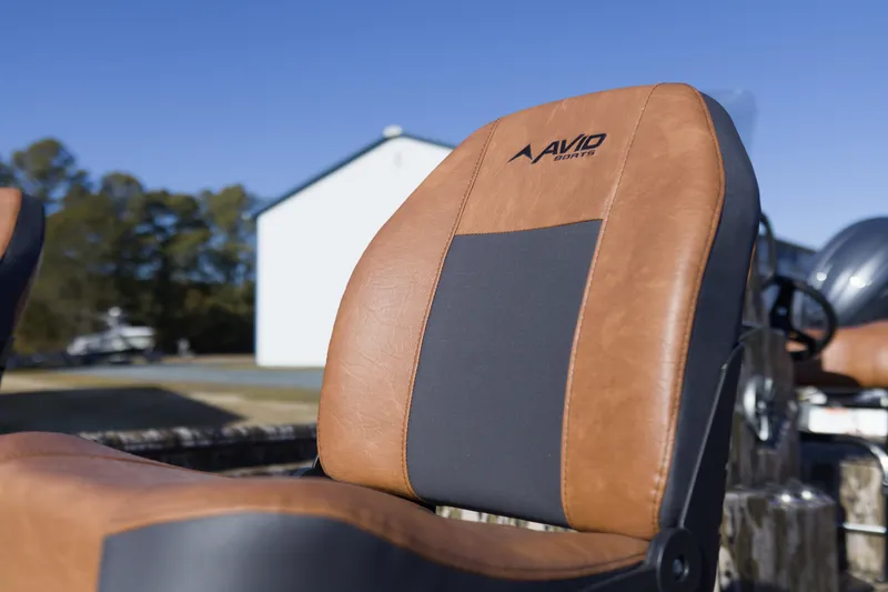 Slide: The Image of Avid 20 Rogue CC 2026 boat seat with brown and black upholstery. - 5
