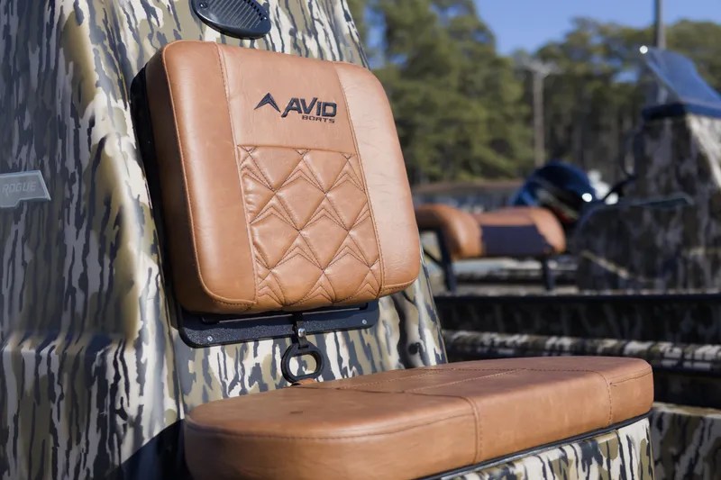 Slide: The Image of Avid 20 Rogue CC 2026 boat seat with tan leather upholstery and camouflage design. - 6