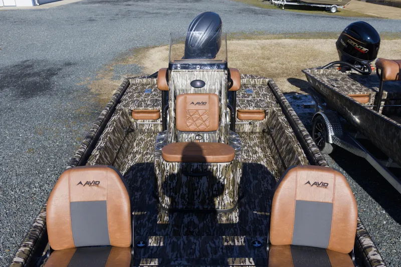 Slide: The Image of 2026 Avid 20 Rogue CC boat with camo design and brown seating. - 8