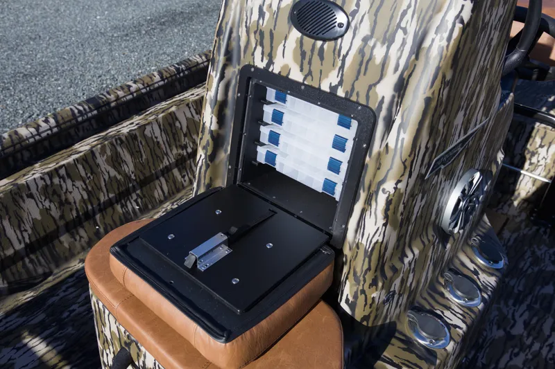 Slide: The Image of 2026 Avid 20 Rogue CC boat console with camouflage design and storage compartments. - 9