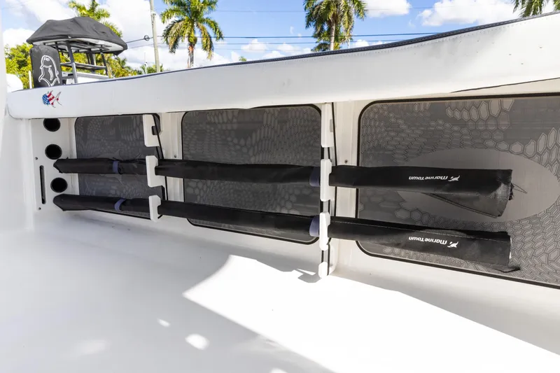 Slide: The Image of 2024 Crevalle 26 HCO boat on trailer under blue sky with clouds. - 10