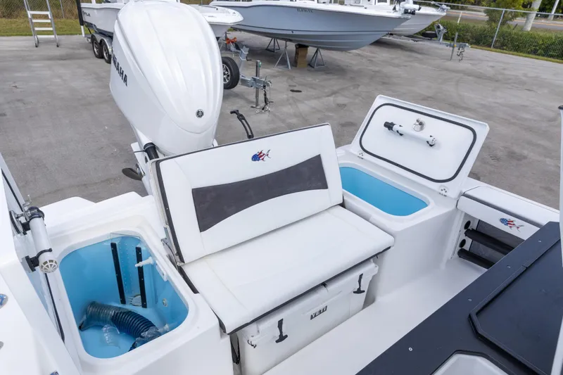 Slide: The Image of 2024 Crevalle 26 HCO boat interior with Yamaha engine and storage compartments. - 3