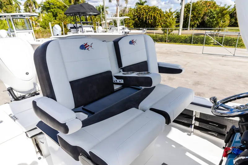 Slide: The Image of 2024 Crevalle 26 HCO boat with luxurious seating and modern design features. - 7