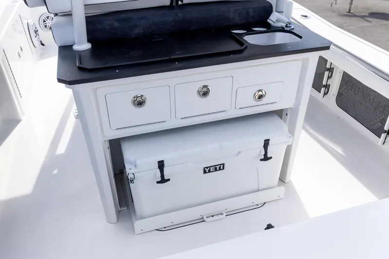 Slide: The Image of 2024 Crevalle 26 HCO boat with storage drawers and Yeti cooler. - 8