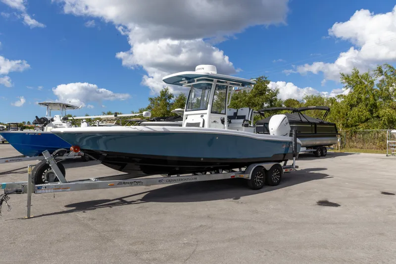 Slide: The Image of 2024 Crevalle 26 HCO boat interior with rod holders and storage compartments. - 9