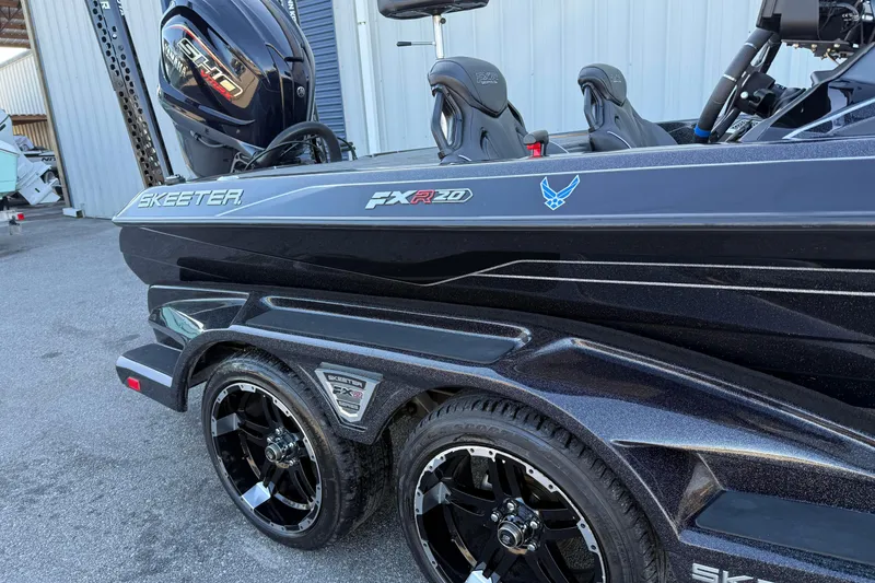 Slide: The Image of 2023 Skeeter FXR20 Select boat with sleek design and Yamaha engine. - 1