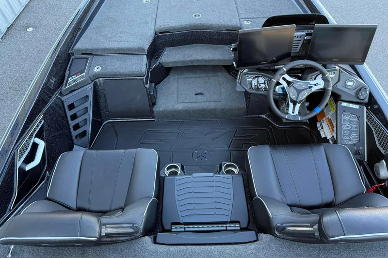 Slide: The Image of 2023 Skeeter FXR20 Select boat interior with dual screens and black seating. - 10
