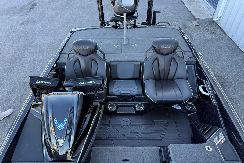 Slide: The Image of 2023 Skeeter FXR20 Select boat interior with Garmin displays and premium seating. - 13