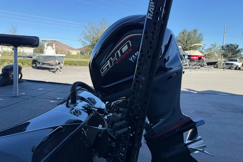 Slide: The Image of 2023 Skeeter FXR20 Select boat with Yamaha VMAX engine in a parking lot. - 6
