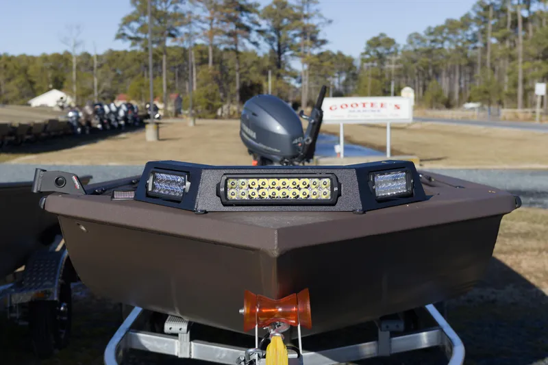 Slide: The Image of 2026 Avid 16 Commander boat with LED lights on display outdoors. - 3