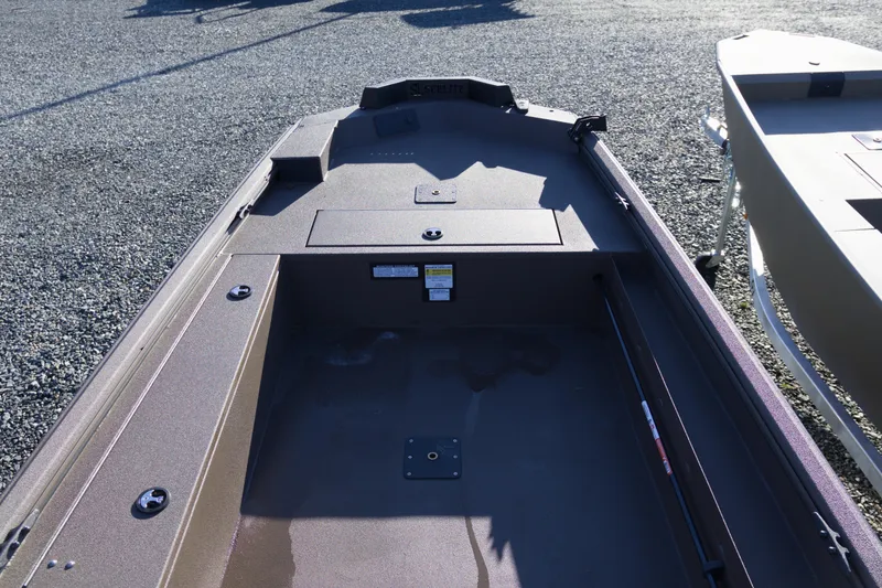 Slide: The Image of 2026 Avid 16 Commander boat interior, showcasing spacious deck and storage compartments. - 5