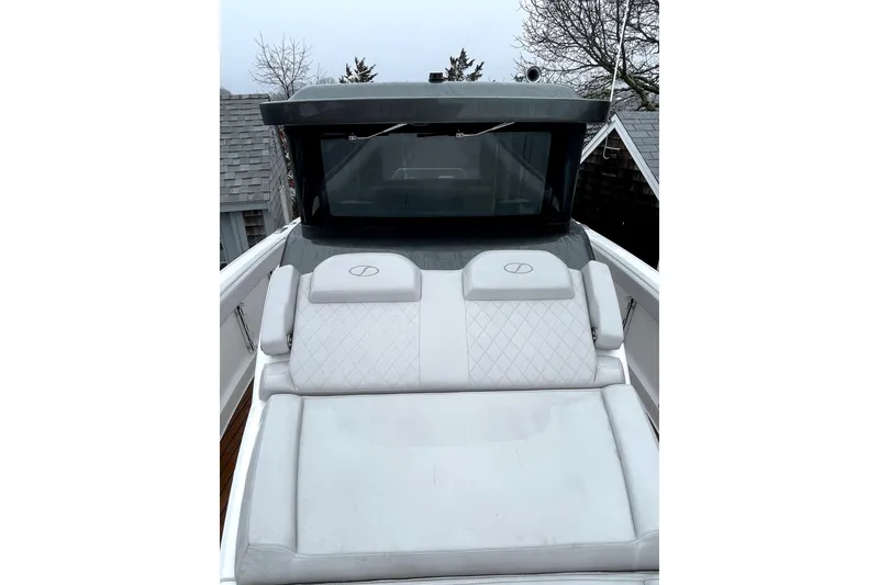 Slide: The Image of 2024 Schaefer V33 boat with luxurious white seating and sleek design. - 10