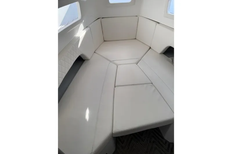 Slide: The Image of Interior view of 2024 Schaefer V33 yacht with modern seating and exterior view. - 15