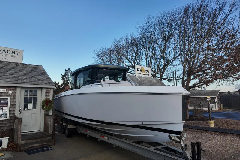 Slide: The Image of 2024 Schaefer V33 boat with twin 300 V8 engines at Sea Tow facility. - 2