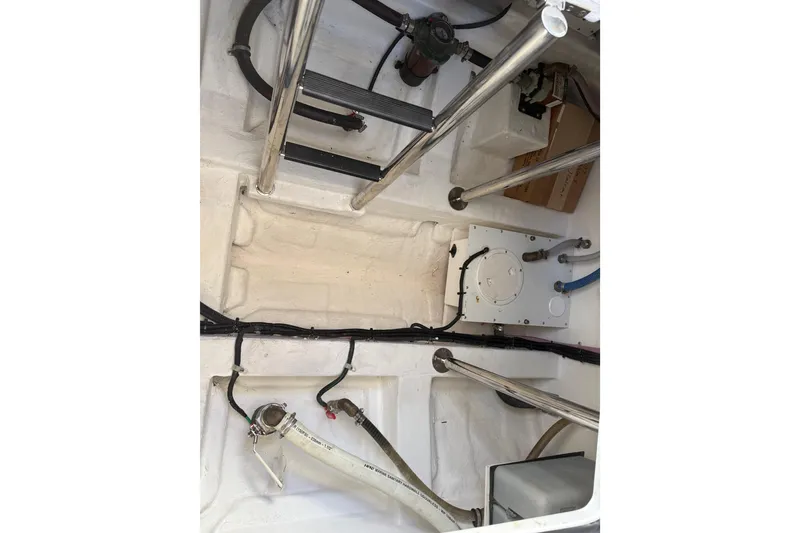 Slide: The Image of 2024 Schaefer V33 boat interior with visible pipes and metal supports. - 32