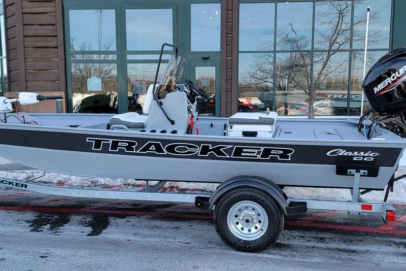The Image of 2026 Tracker Bass Tracker Classic CC boat on trailer, parked outside a building. - 0
