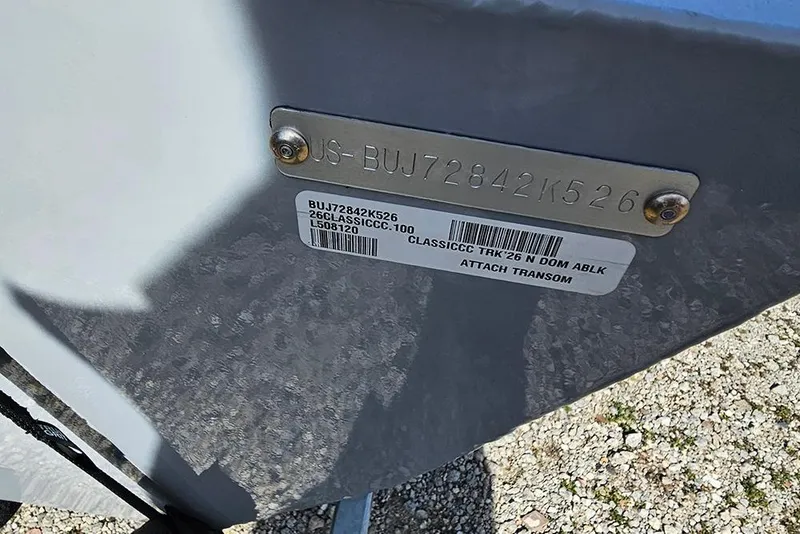 Slide: The Image of 2026 Tracker Bass Tracker Classic CC hull identification number plate on boat transom. - 23