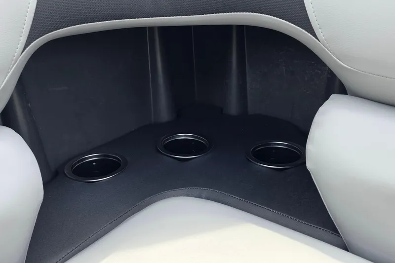 Slide: The Image of Interior of 2026 Sun Tracker SportFish 20 DLX boat with three cup holders. - 12