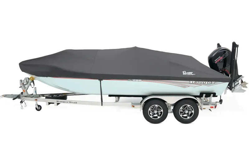 Slide: The Image of 2026 Ranger RB200 boat with Mercury engine on a trailer, parked outdoors. - 15