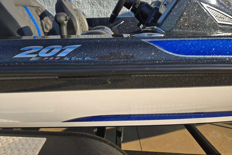 Slide: The Image of 2027 Caymas 201 Pro boat with glittery blue and black detailing. - 4