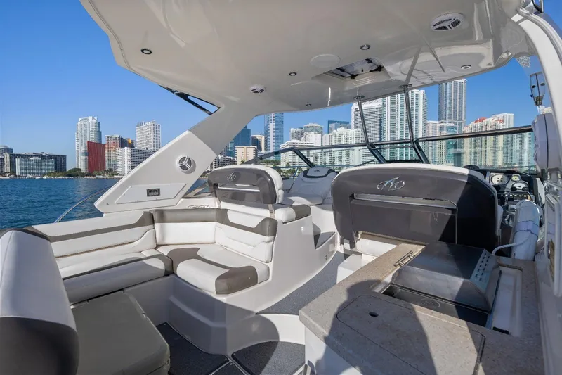 Slide: The Image of 2012 Monterey 400 Sport Yacht interior with city skyline in the background. - 15