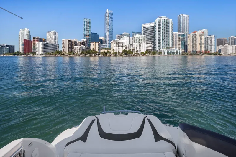 Slide: The Image of Monterey 400 Sport Yacht (2012) cruising with city skyline view. - 16