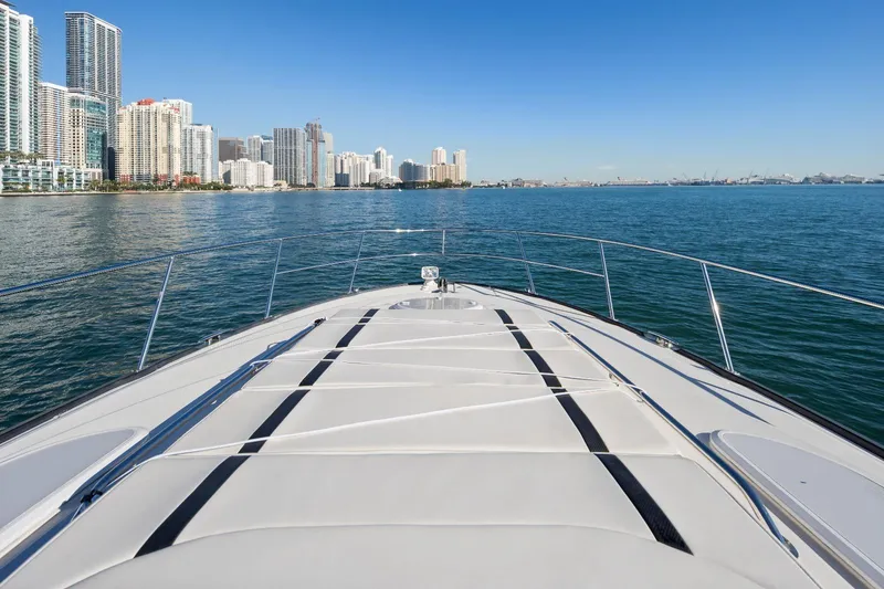 Slide: The Image of Bow view of 2012 Monterey 400 Sport Yacht cruising near city skyline. - 19