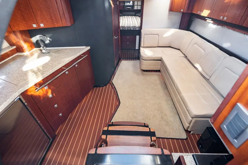 Slide: The Image of Luxurious interior of 2012 Monterey 400 Sport Yacht with modern kitchen and comfortable seating. - 21