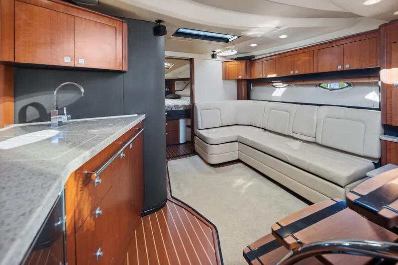 Slide: The Image of Luxurious interior of 2012 Monterey 400 Sport Yacht with modern kitchen and seating area. - 24