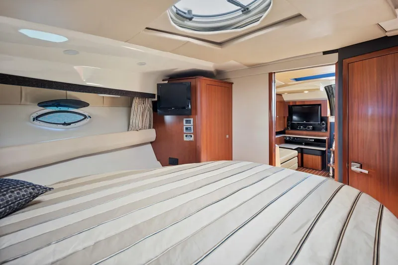 Slide: The Image of Luxurious interior of 2012 Monterey 400 Sport Yacht with cozy bedroom and entertainment area. - 25