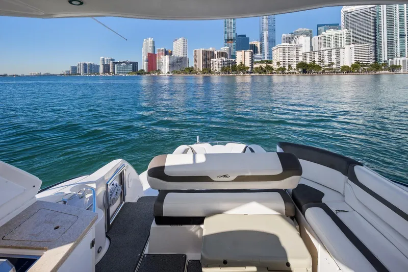 Slide: The Image of 2012 Monterey 400 Sport Yacht with city skyline view on calm waters. - 8