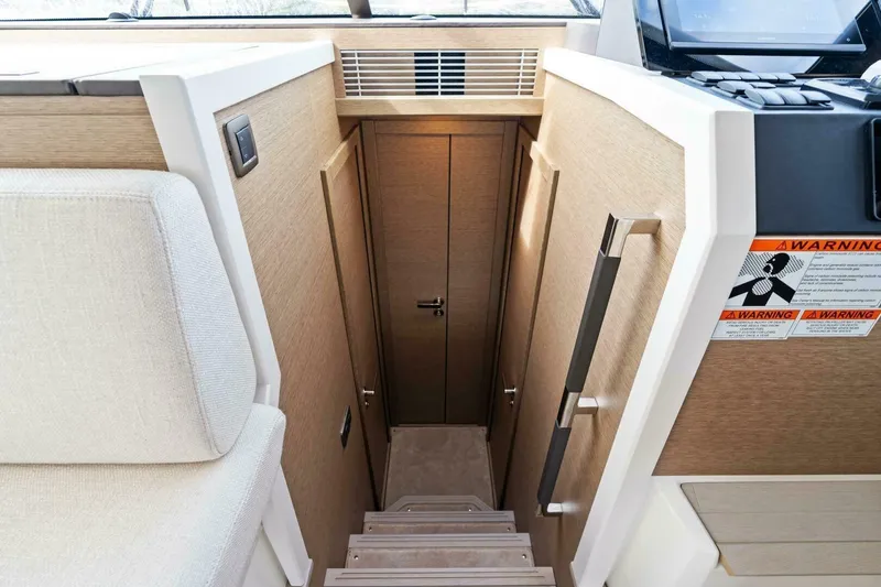 Slide: The Image of 2024 42 Prestige Flybridge - Companionway to Staterooms - 17