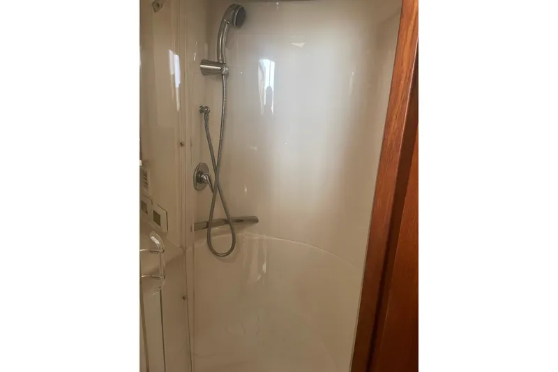 Slide: The Image of Compact bathroom in 2006 Tiara Yachts 3800 Open, featuring toilet and sink. - 13