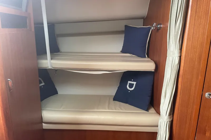 Slide: The Image of 2006 Tiara Yachts 3800 Open interior with cozy seating and wooden table. - 15