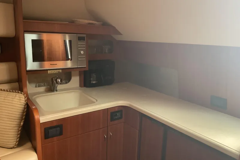 Slide: The Image of Luxurious cabin interior of 2006 Tiara Yachts 3800 Open with patterned bedding. - 17