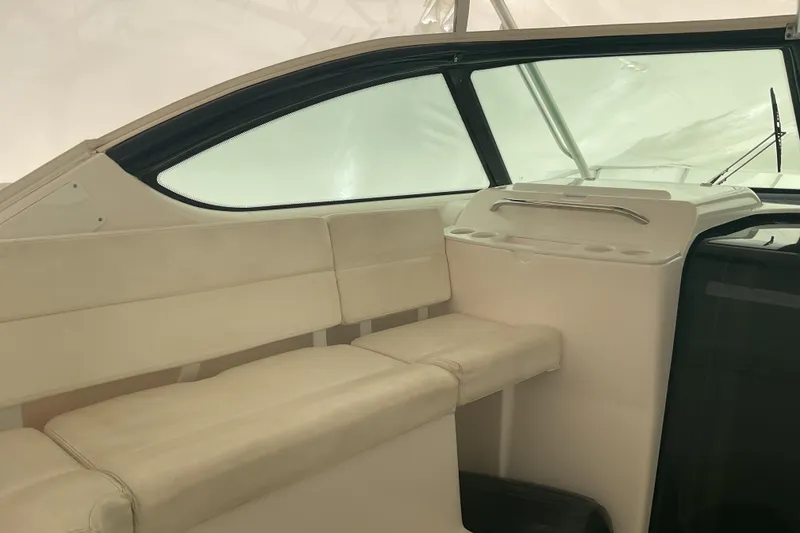 Slide: The Image of 2006 Tiara Yachts 3800 Open interior with white seating and helm station. - 18