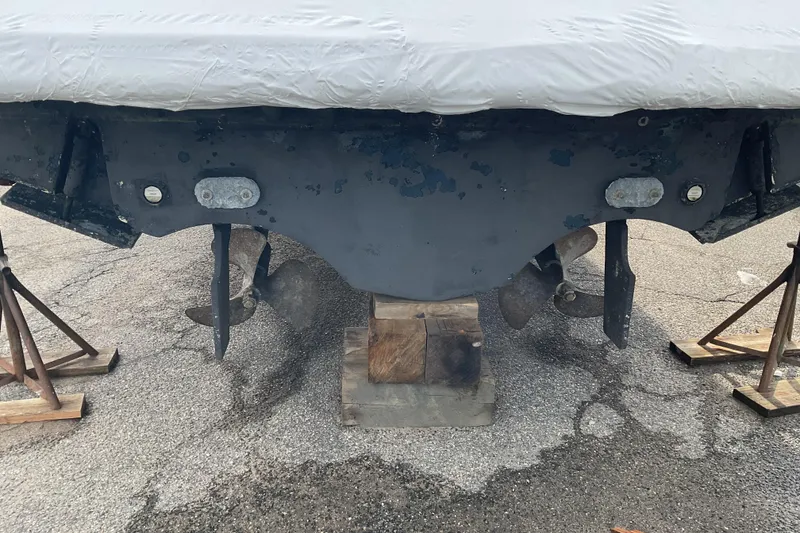 Slide: The Image of 2006 Tiara Yachts 3800 Open boat hull and propellers on stands. - 22