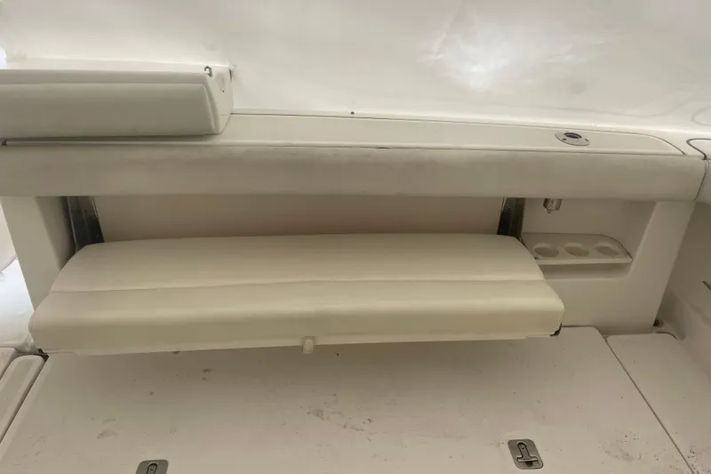 Slide: The Image of 2006 Tiara Yachts 3800 Open interior seating with cup holders and storage. - 23