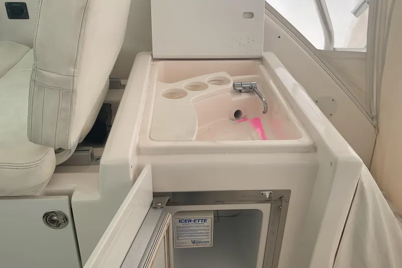 Slide: The Image of Interior of 2006 Tiara Yachts 3800 Open featuring sink and seating area. - 27